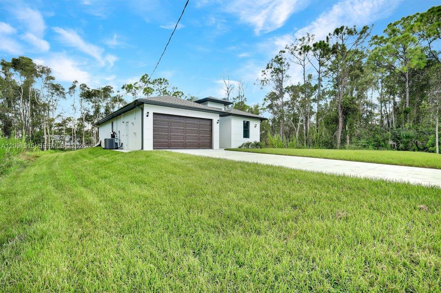 Front exterior of a new home in , Punta Gorda, FL, highlighting curb appeal (Image 18).
