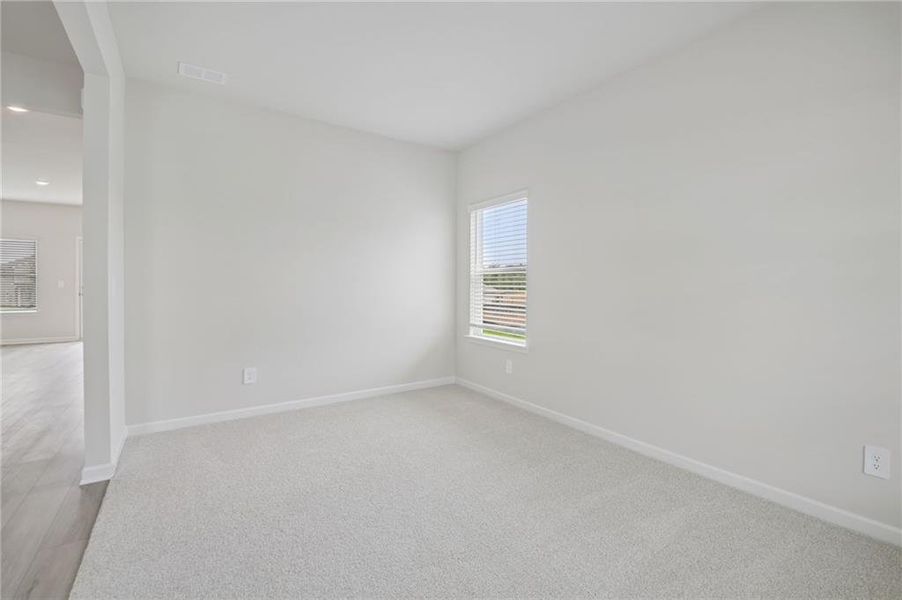 Spacious, unfurnished interior of a new home in Northwoods at Mirror Lake, Villa Rica (Image 42).