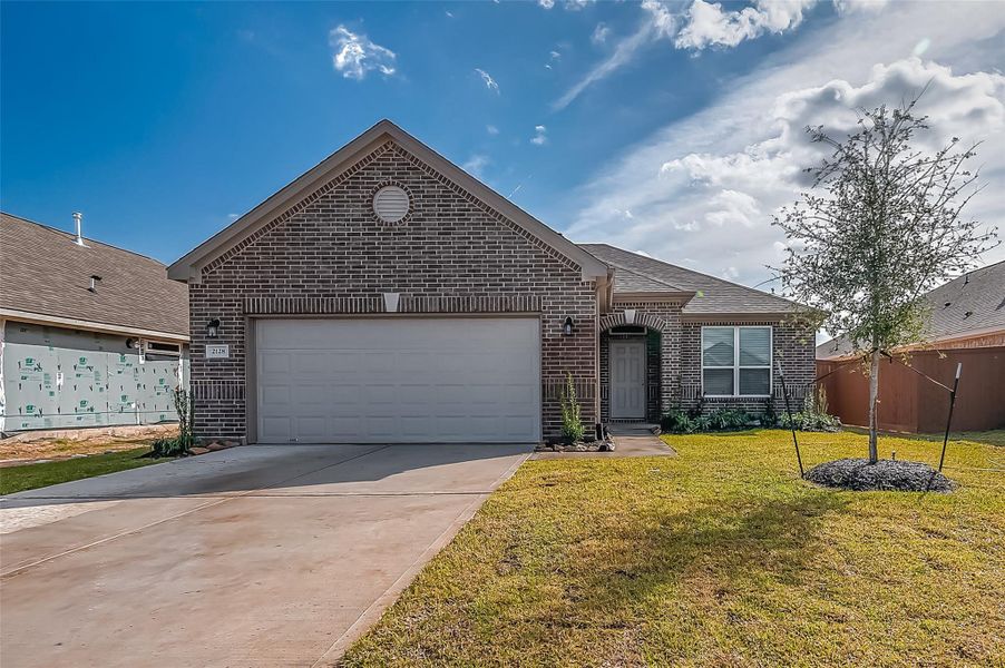 Front exterior of a new home in Lago Mar, Texas City, TX, highlighting curb appeal (Image 18). Front exterior of a new home in Lago Mar, Texas City, TX, highlighting curb appeal (Image 18).