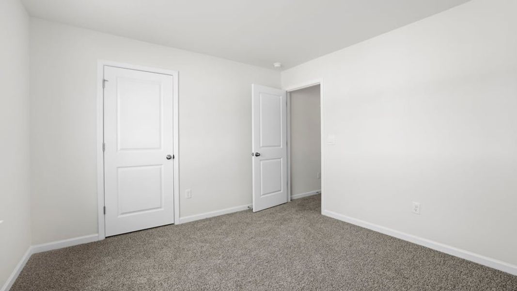 Spacious, unfurnished interior of a new home in Bentley Park, Greenwood (Image 27).