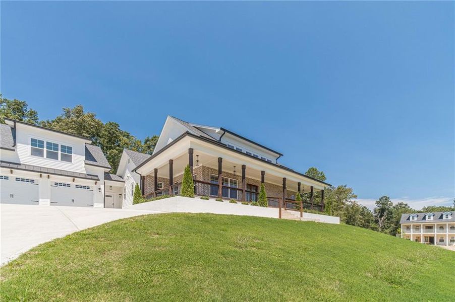 Front exterior of a new home in , Dacula, GA, highlighting curb appeal (Image 26).
