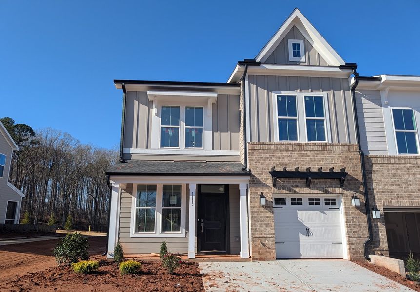 Front exterior of a new home in Ovation at Sweetbrier, Durham, NC, highlighting curb appeal (Image 1). Front exterior of a new home in Ovation at Sweetbrier, Durham, NC, highlighting curb appeal (Image 1).