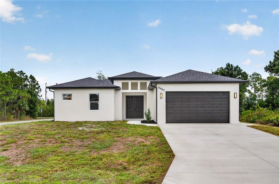 Front exterior of a new home in , Port Charlotte, FL, highlighting curb appeal (Image 27). Front exterior of a new home in , Port Charlotte, FL, highlighting curb appeal (Image 27).