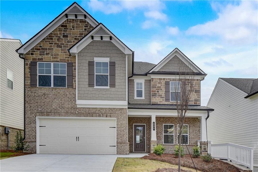 Front exterior of a new home in Summerlin, Winder, GA, highlighting curb appeal (Image 2). Front exterior of a new home in Summerlin, Winder, GA, highlighting curb appeal (Image 2).