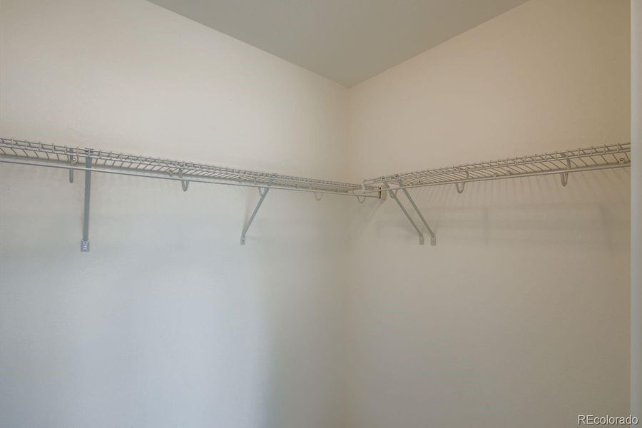 Primary Walk-in Closet Primary Walk-in Closet