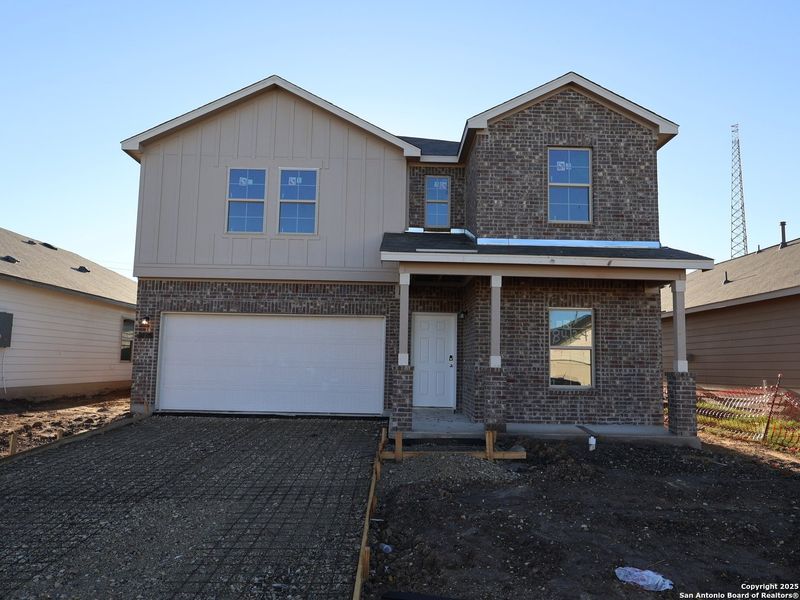 Front exterior of a new home in Agave, San Antonio, TX, highlighting curb appeal (Image 2).