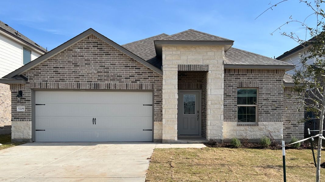 Front exterior of a new home in Three Creeks - Colt Creek, Belton, TX, highlighting curb appeal (Image 2). Front exterior of a new home in Three Creeks - Colt Creek, Belton, TX, highlighting curb appeal (Image 2).