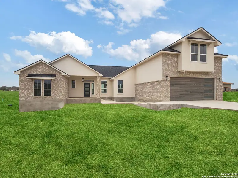 Front exterior of a new home in , La Vernia, TX, highlighting curb appeal (Image 2).