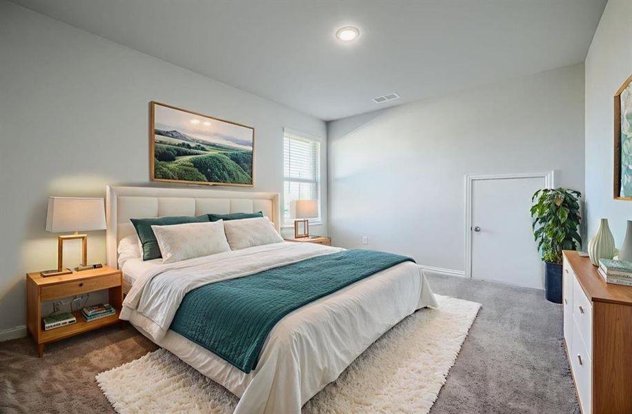 Bedroom with carpet floors and baseboards Bedroom with carpet floors and baseboards