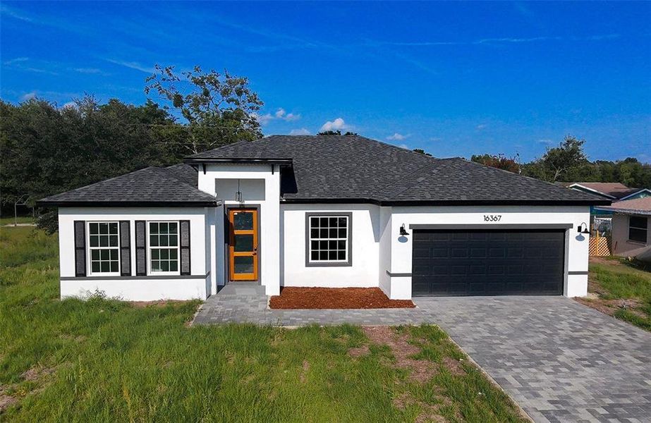 Front exterior of a new home in , Ocala, FL, highlighting curb appeal (Image 18). Front exterior of a new home in , Ocala, FL, highlighting curb appeal (Image 18).