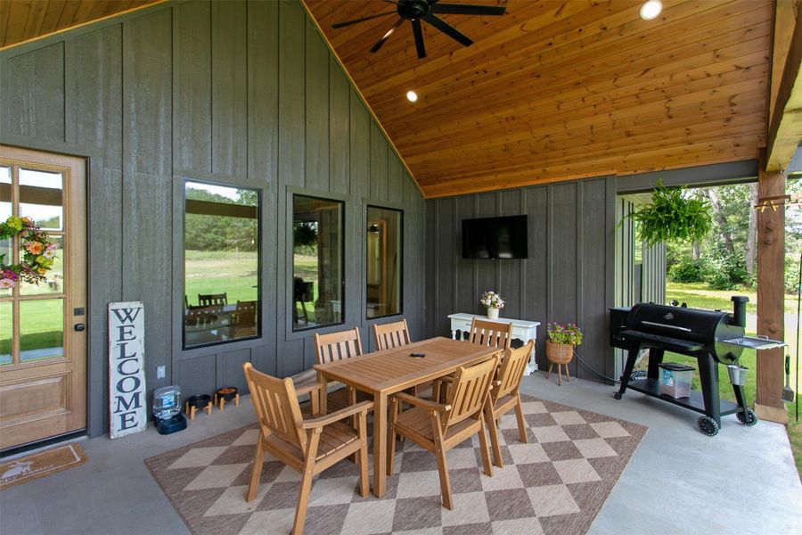 View of patio featuring ceiling fan, outdoor dining space, and grilling area
