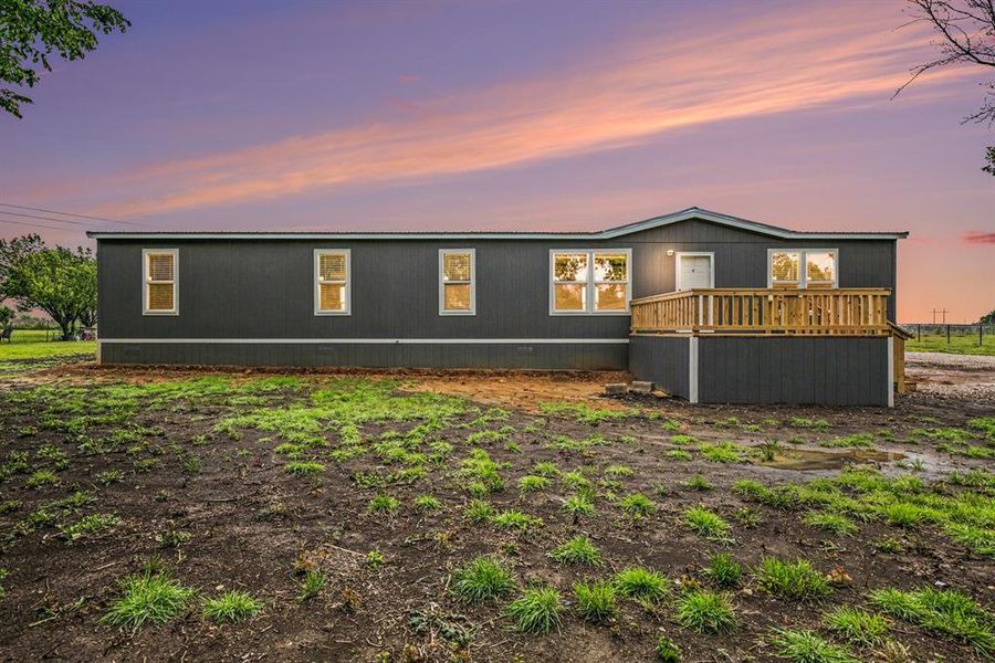 BRAND NEW! Nestled on one acre - Be the first to live in this manufactured home with white trim details and wooden front deck. Lots of upgrades inside!