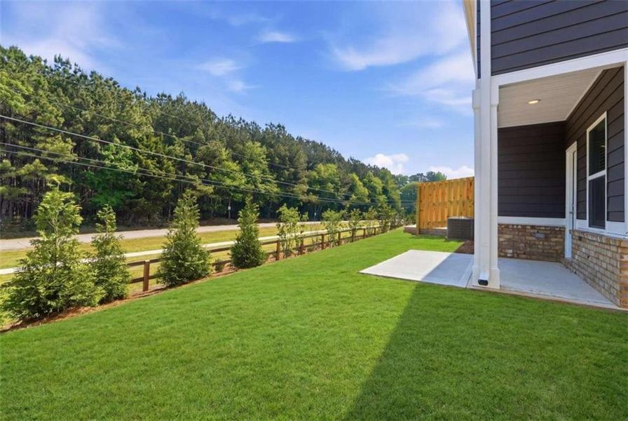 Exterior details and patio area of a home in Parkway James, Snellville (Image 18).