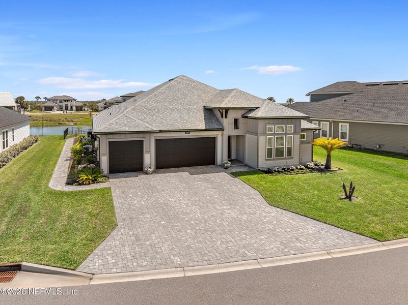 Front exterior of a new home in Marshes of Madeira, St. Augustine, FL, highlighting curb appeal (Image 1). Front exterior of a new home in Marshes of Madeira, St. Augustine, FL, highlighting curb appeal (Image 1).