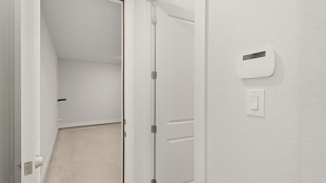 Representative unfurnished interior of a home built from the Brenner by Chesmar Homes in Newhaven, Manor (Image 24).