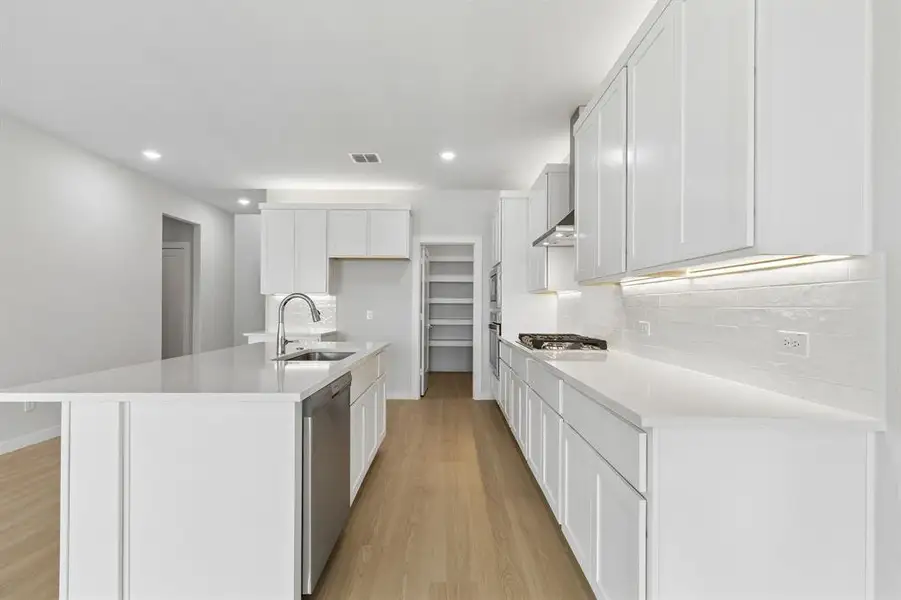 Kitchen in the Winters home plan by Trophy Signature Homes – REPRESENTATIVE PHOTO Kitchen in the Winters home plan by Trophy Signature Homes – REPRESENTATIVE PHOTO