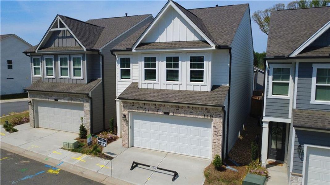Front exterior of a new home in The Village at Shallowford, Kennesaw, GA, highlighting curb appeal (Image 2). Front exterior of a new home in The Village at Shallowford, Kennesaw, GA, highlighting curb appeal (Image 2).