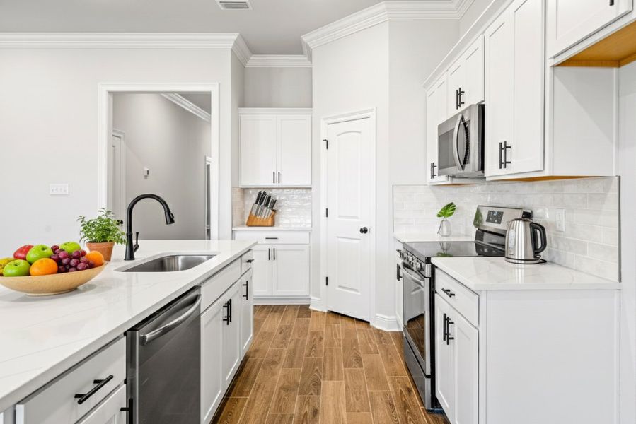 Front exterior of a new home in Sentinel Ridge, Pace, FL, highlighting curb appeal (Image 2).