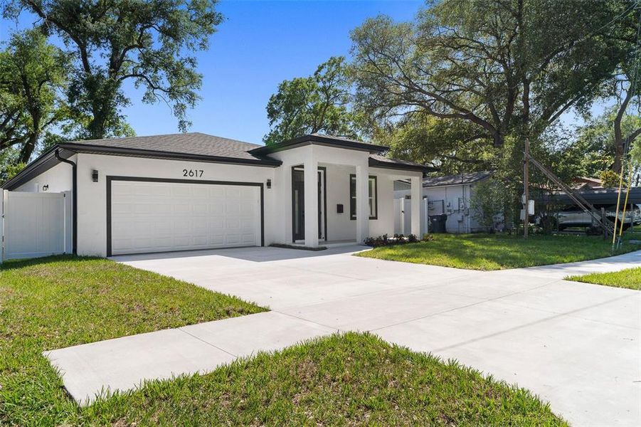 Front exterior of a new home in , Tampa, FL, highlighting curb appeal (Image 18).