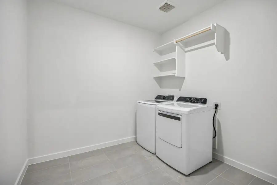 Utility Room in the Wimbledon home plan by Trophy Signature Homes – REPRESENTATIVE PHOTO Utility Room in the Wimbledon home plan by Trophy Signature Homes – REPRESENTATIVE PHOTO