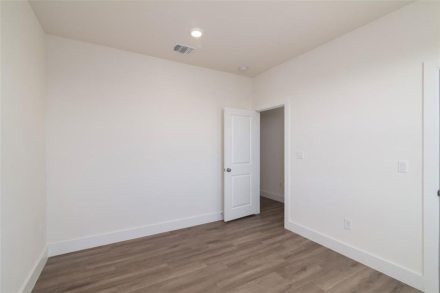 Unfurnished room with wood-type flooring