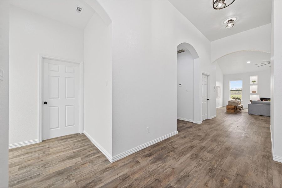 Inviting entryway showcasing soaring cathedral ceilings and a spacious layout.