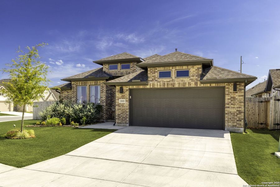 Front exterior of a new home in The Village of Mill Creek 50', Seguin, TX, highlighting curb appeal (Image 21).