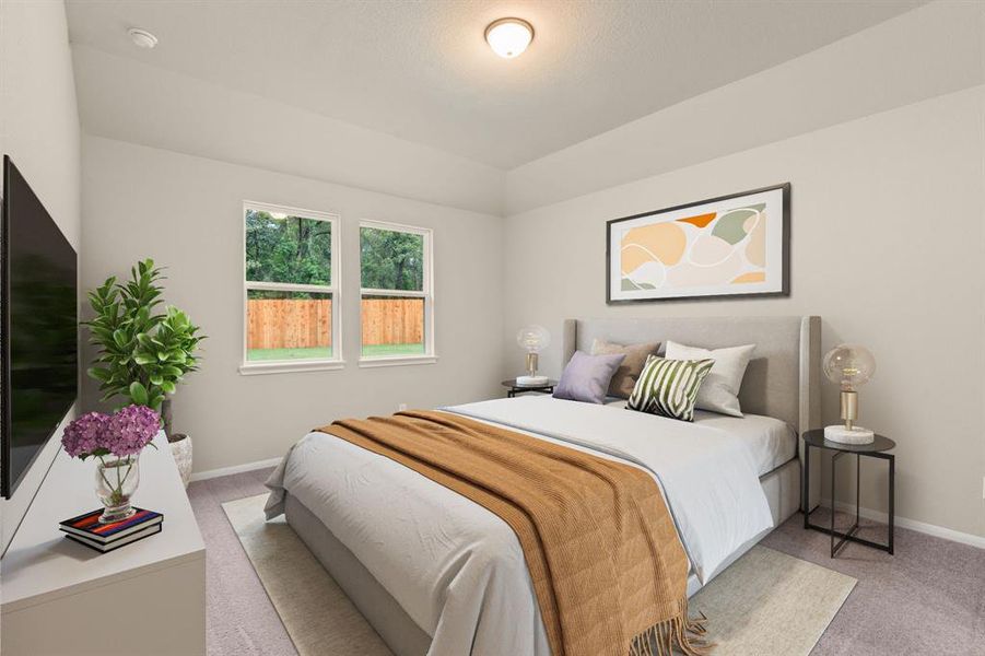 The primary bedroom is generously sized, creating a tranquil and spacious retreat that offers ample room for relaxation. Featuring plush carpet, high ceilings, fresh paint, and large windows that lets in natural lighting throughout the day.