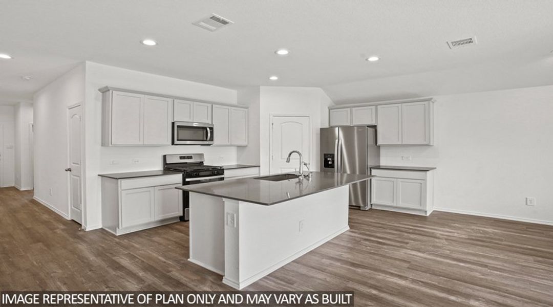 Representative furnished interior of a home built from the Texas Cali by D.R. Horton in Sunterra, Katy (Image 5).
