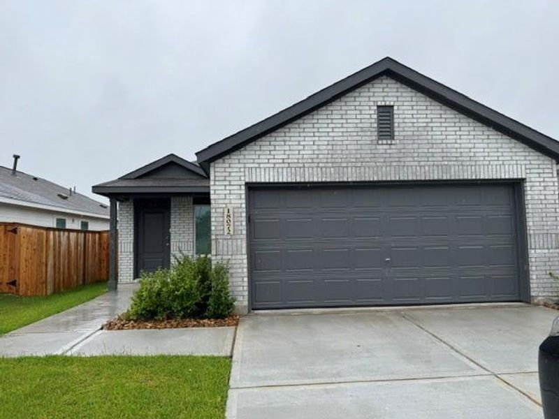 Front exterior of a new home in , New Caney, TX, highlighting curb appeal (Image 2). Front exterior of a new home in , New Caney, TX, highlighting curb appeal (Image 2).