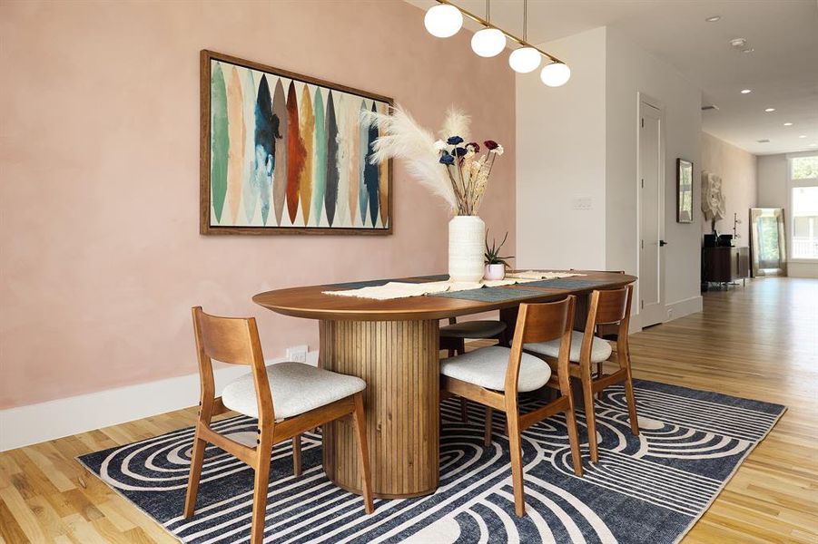 Spacious dining area with lightly contrasting accent wall