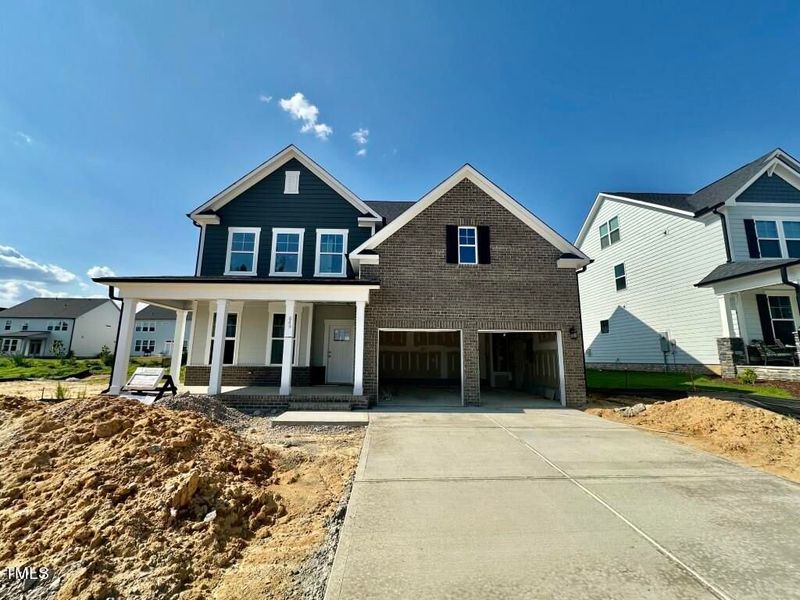 Front exterior of a new home in Glenmere, Knightdale, NC, highlighting curb appeal (Image 2). Front exterior of a new home in Glenmere, Knightdale, NC, highlighting curb appeal (Image 2).