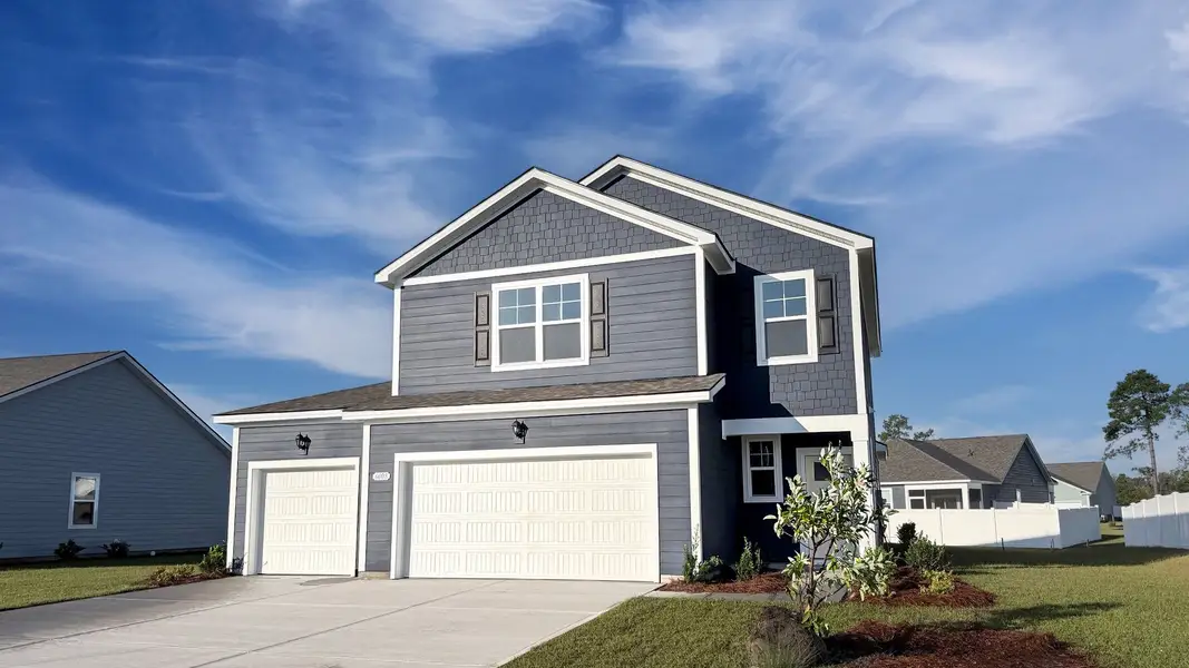 Front exterior of a new home in Auberon Woods, Conway, SC, highlighting curb appeal (Image 2). Front exterior of a new home in Auberon Woods, Conway, SC, highlighting curb appeal (Image 2).