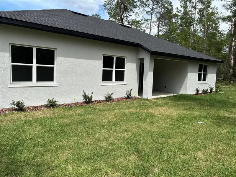 Exterior details and patio area of a home in , Brooksville (Image 3). Exterior details and patio area of a home in , Brooksville (Image 3).