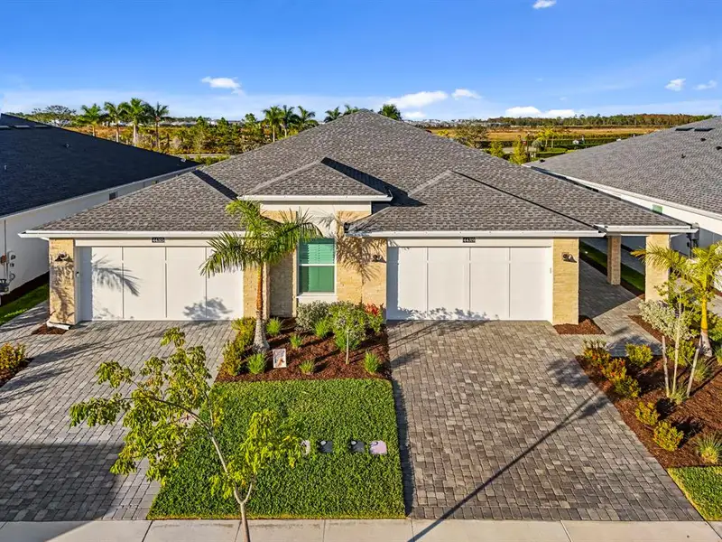Front exterior of a new home in , Punta Gorda, FL, highlighting curb appeal (Image 2).
