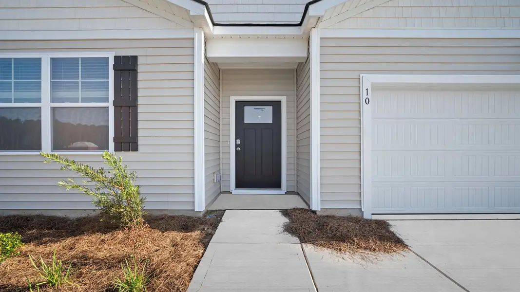 Front exterior of a new home in Rice Hope, Port Wentworth, GA, highlighting curb appeal (Image 2).