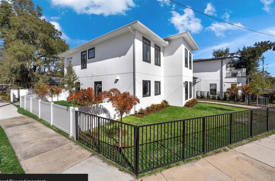 Front exterior of a new home in , Orlando, FL, highlighting curb appeal (Image 27).