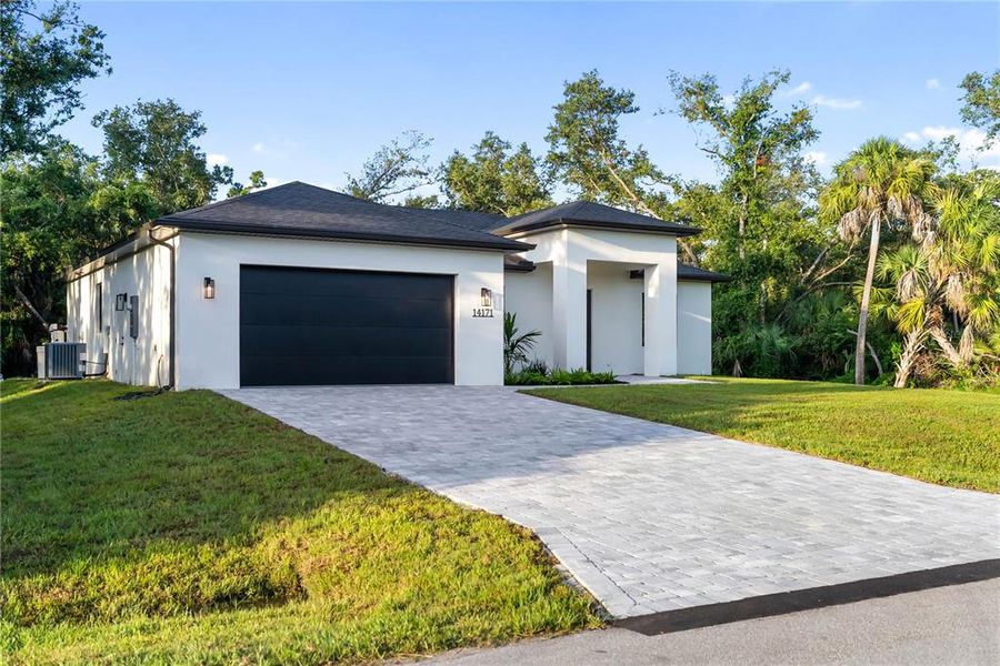 Front exterior of a new home in , Port Charlotte, FL, highlighting curb appeal (Image 25).