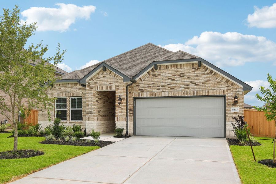Front exterior of a new home in Massey Oaks - Premier Series, Pearland, TX, highlighting curb appeal (Image 18). Front exterior of a new home in Massey Oaks - Premier Series, Pearland, TX, highlighting curb appeal (Image 18).