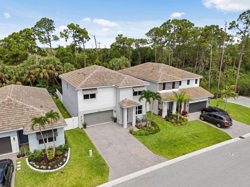 Front exterior of a new home in Reserve at Jupiter, Jupiter, FL, highlighting curb appeal (Image 28).