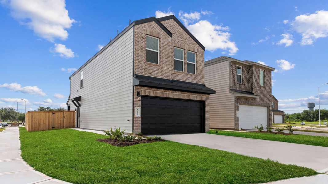 Front exterior of a new home in Lexington Village, Missouri City, TX, highlighting curb appeal (Image 29). Front exterior of a new home in Lexington Village, Missouri City, TX, highlighting curb appeal (Image 29).