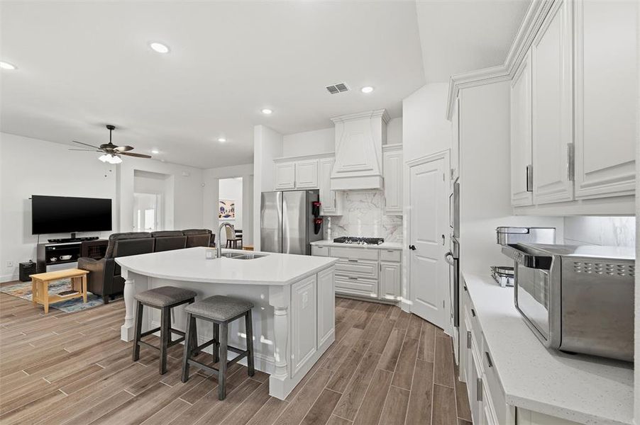 Open kitchen and living space is perfect for holiday gatherings Open kitchen and living space is perfect for holiday gatherings