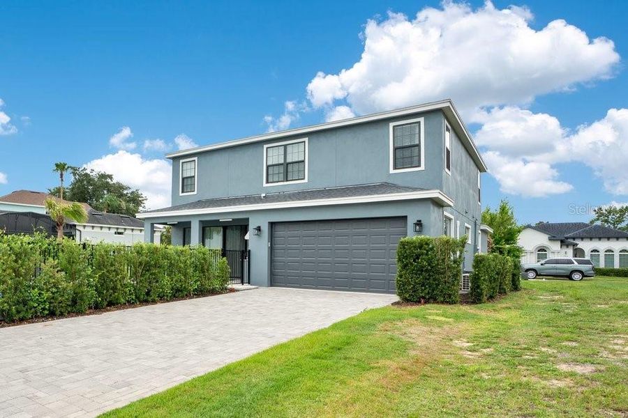 Front exterior of a new home in , Reunion, FL, highlighting curb appeal (Image 20).