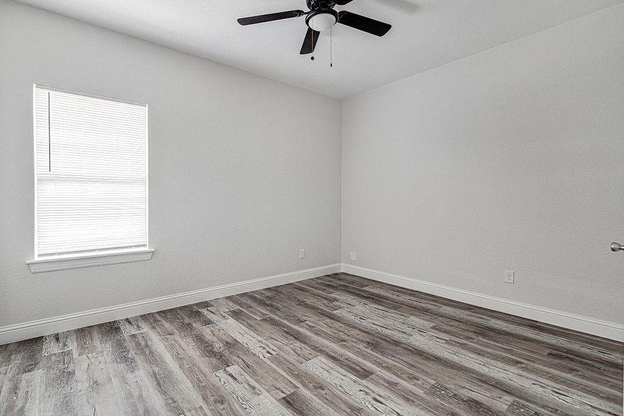 Bedroom 2 room with ceiling fan and hardwood / wood-style floors