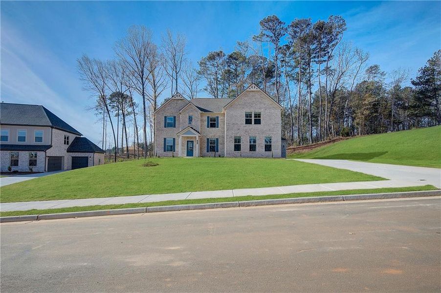 Front exterior of a new home in Trinity Park, McDonough, GA, highlighting curb appeal (Image 16).