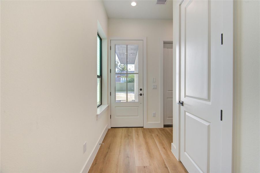 Welcome guests through this inviting entryway, featuring a bright hallway leading to the first floor living space. Welcome guests through this inviting entryway, featuring a bright hallway leading to the first floor living space.