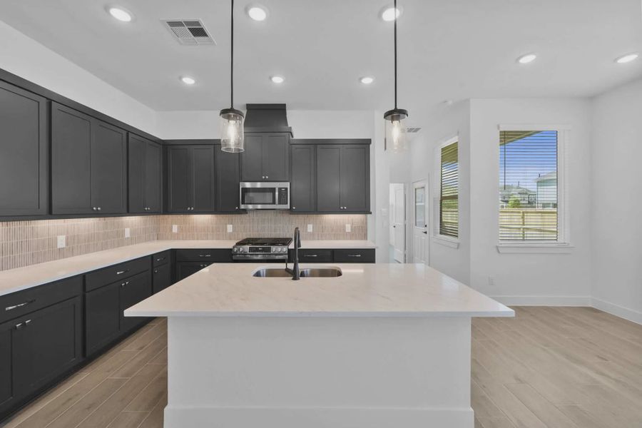 Representative furnished interior of a home built from the Versailles by Chesmar Homes in Meridiana Chateau, Manvel (Image 11).