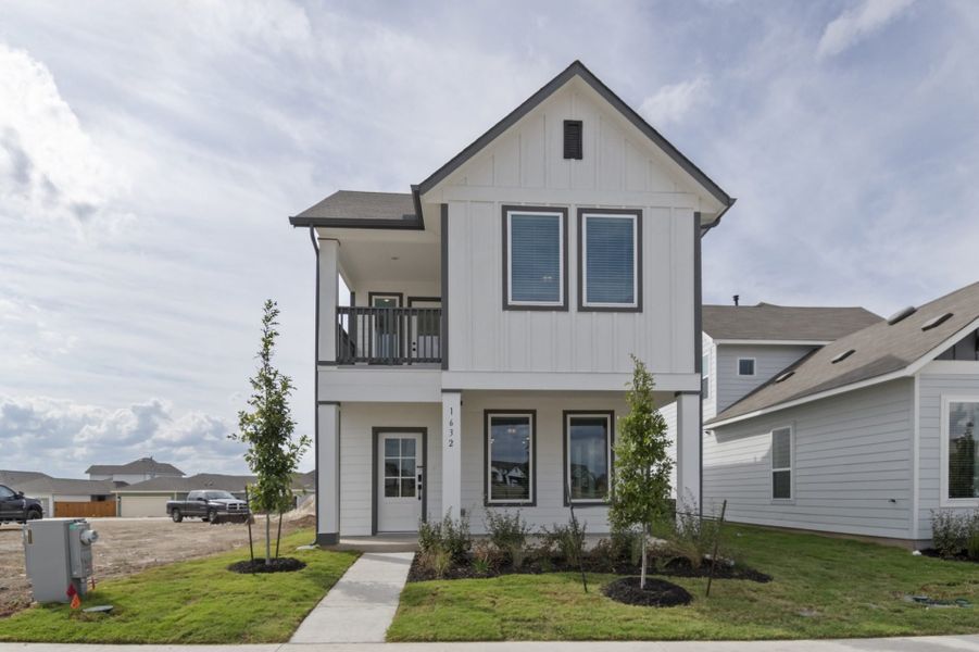 Front exterior of a new home in Trace, San Marcos, TX, highlighting curb appeal (Image 2). Front exterior of a new home in Trace, San Marcos, TX, highlighting curb appeal (Image 2).