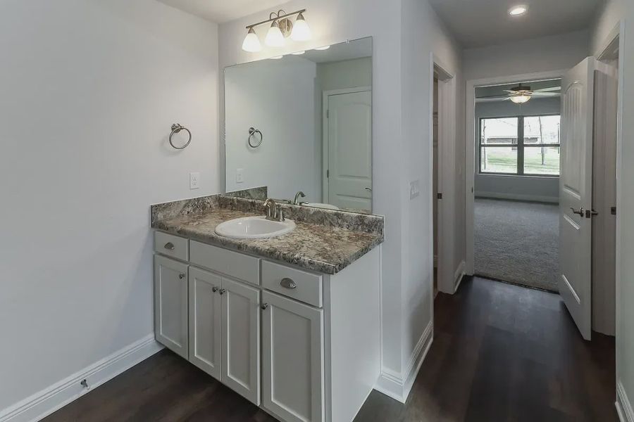 Representative furnished interior of a home built from the Plan 2502 by Adams Homes in Cedar Creek at Deerpoint Lake, Panama City (Image 10).