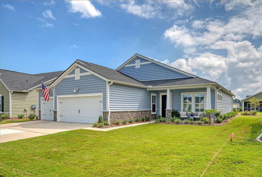 Front exterior of a new home in Horizons at Summers Corner | 55+: The Estates, Summerville, SC, highlighting curb appeal (Image 28).